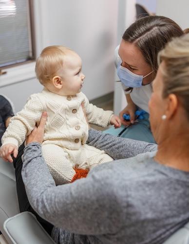 Dr Mooney working with a baby